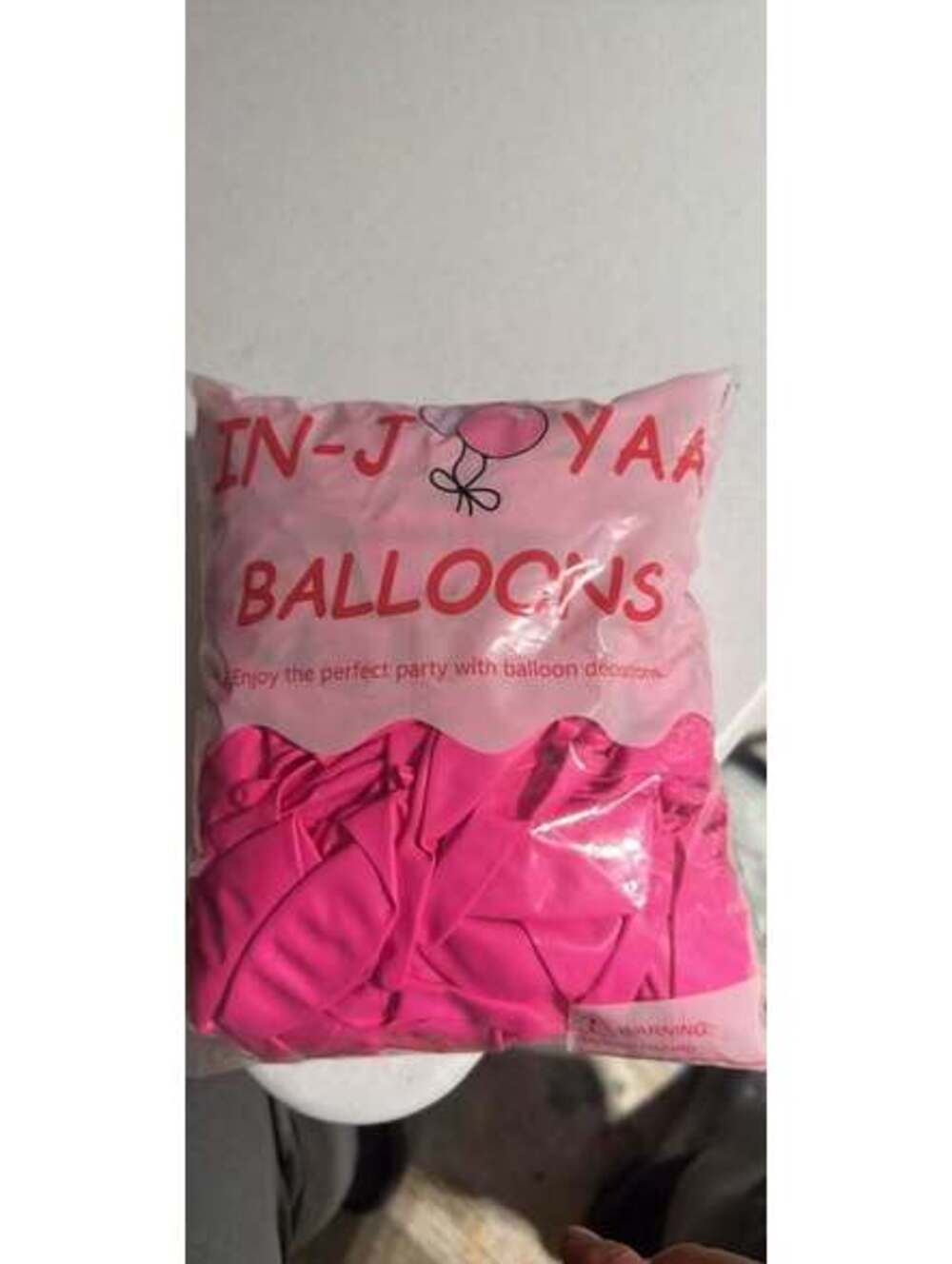 Pink Party Balloons and Green Grocery Bag Carriers